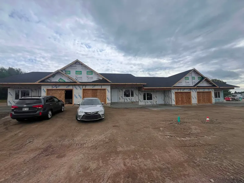 Multi-unit residential building with attached garages under construction